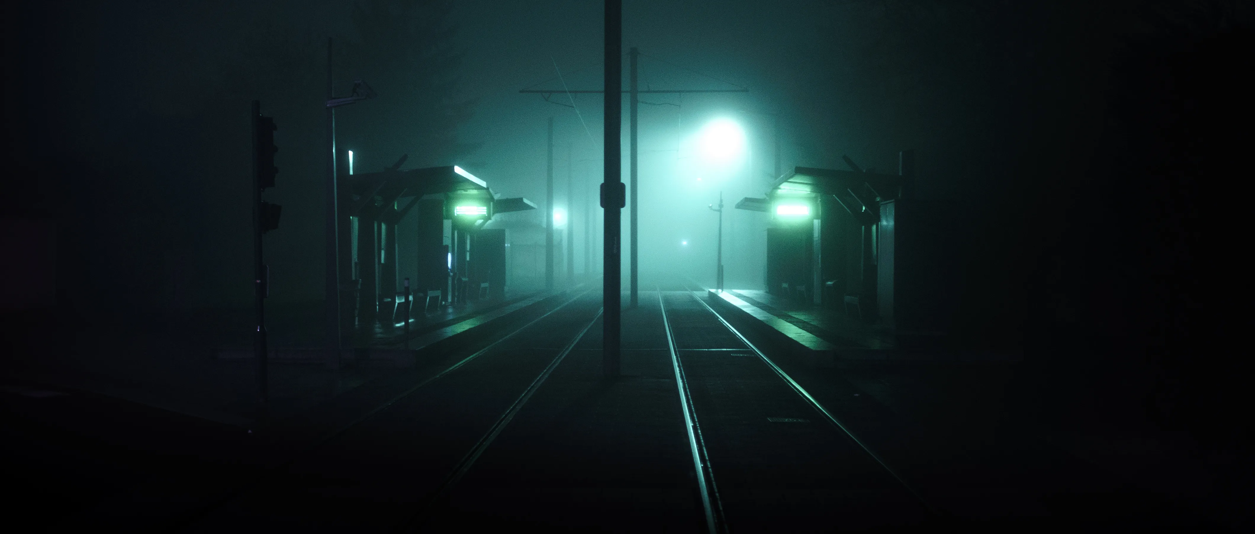 Tram tracks converging into fog at night, the shelters lit green and a lamp burning through the mist